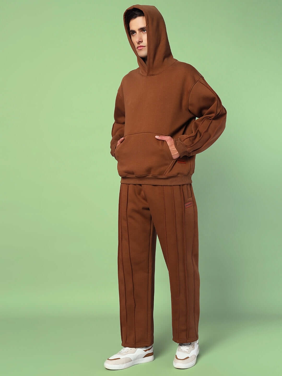 Model wearing URBAN FLEECE CARGO PANTS BROWN showcasing cozy fleece and streetwear design.