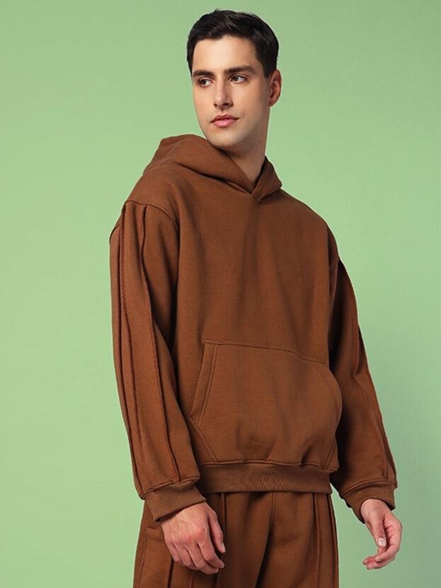 Man wearing Urban Solid Plated Fleece Hoodie Brown, showcasing stylish, warm, and durable design for everyday wear.