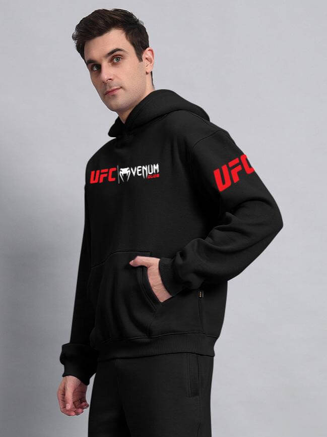 Man wearing WEARDUDS VENUM FLEECE HOODIE BLACK, showcasing cozy design and custom fit option for personalized style.