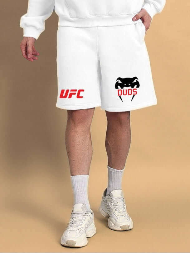 Person wearing WEARDUDS VENUM FLEECE CO-ORD WHITE shorts featuring UFC and DUDS logos, customizable size available.