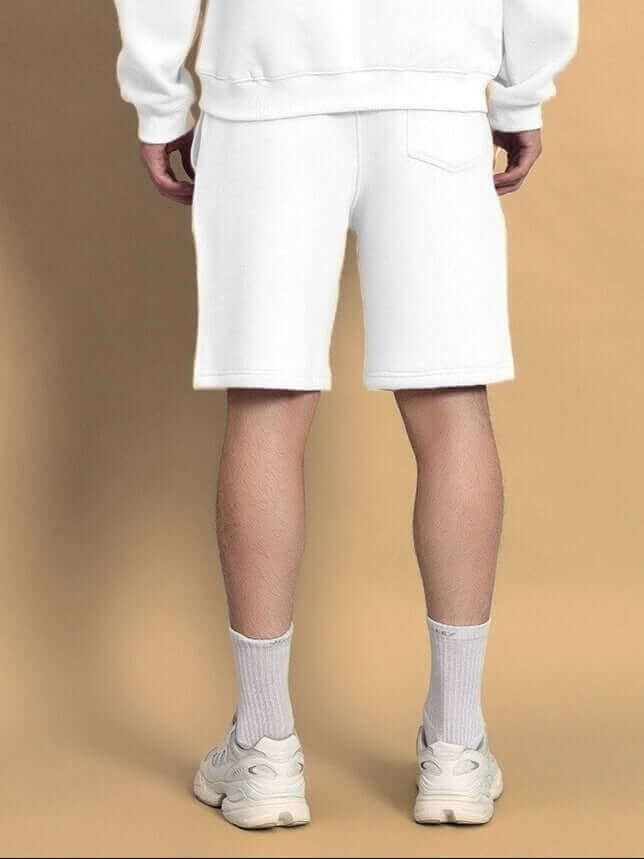 Back view of model wearing WEARDUDS VENUM FLEECE CO-ORD WHITE, showcasing the design and fit of the fleece apparel.