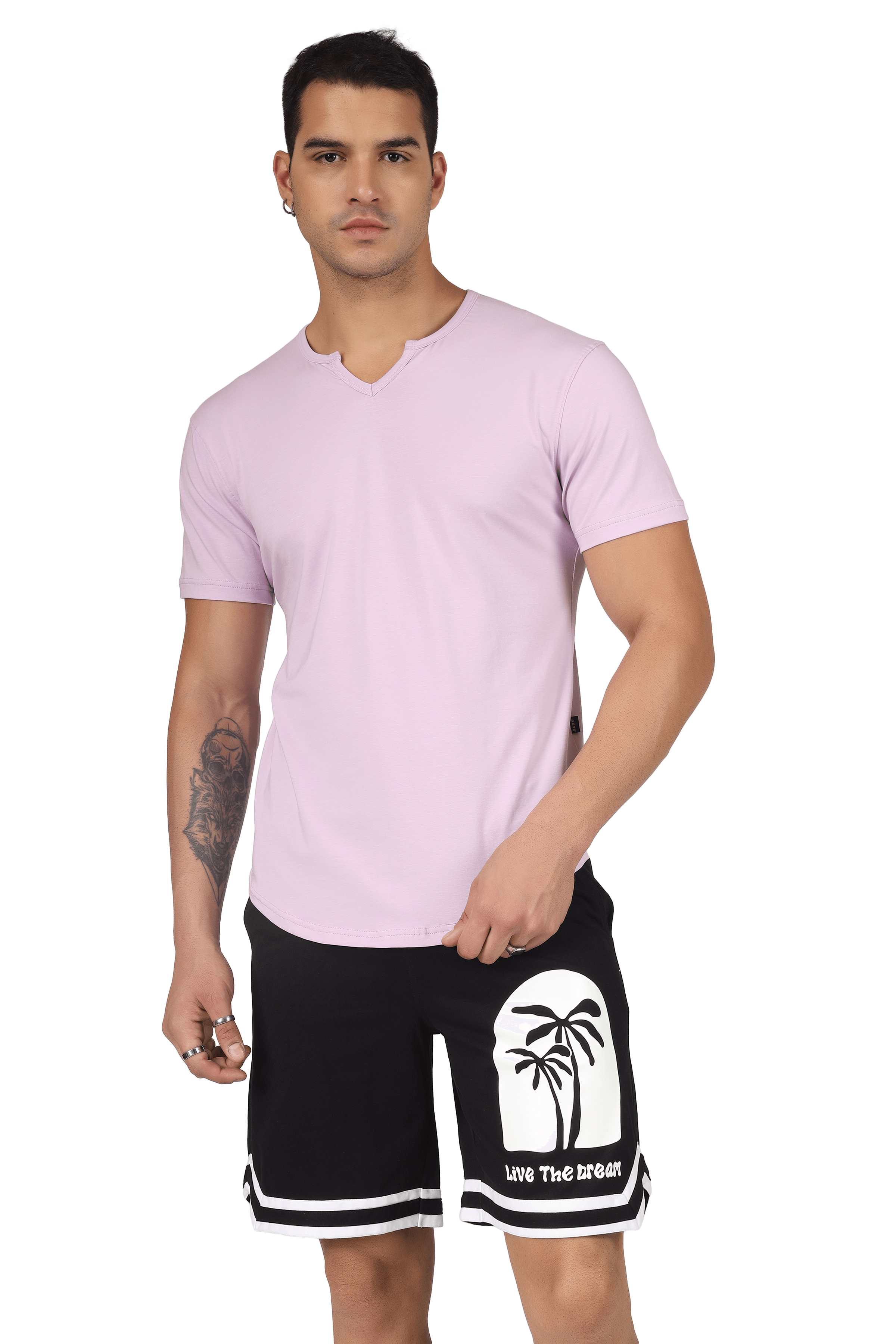 Model wearing lilac Viking regular fit T-shirt in premium cotton, paired with black shorts featuring palm tree print. India origin.