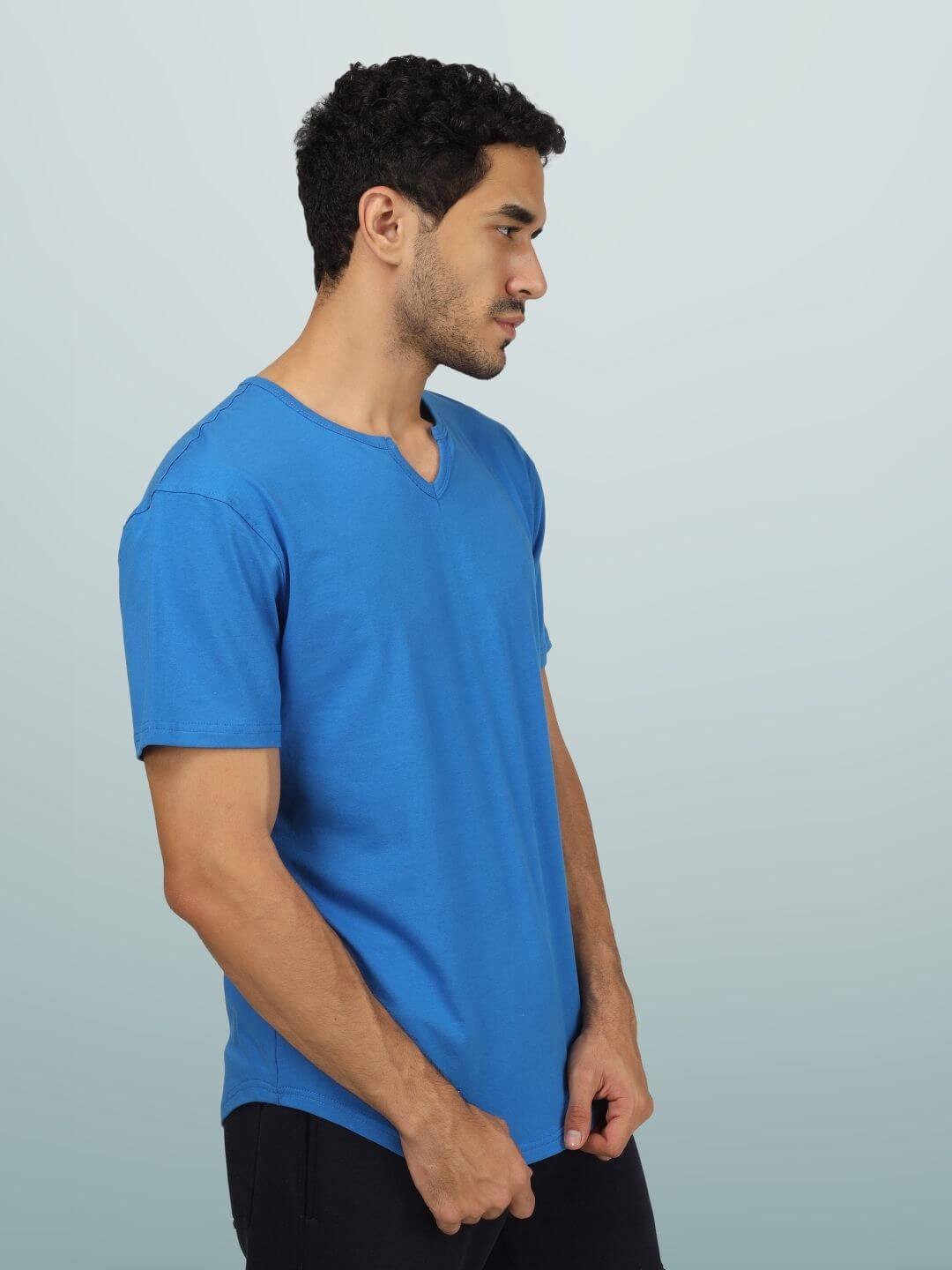 Man wearing Viking regular fit royal blue t-shirt made from 100% cotton, showcasing the side profile and V-neck design.