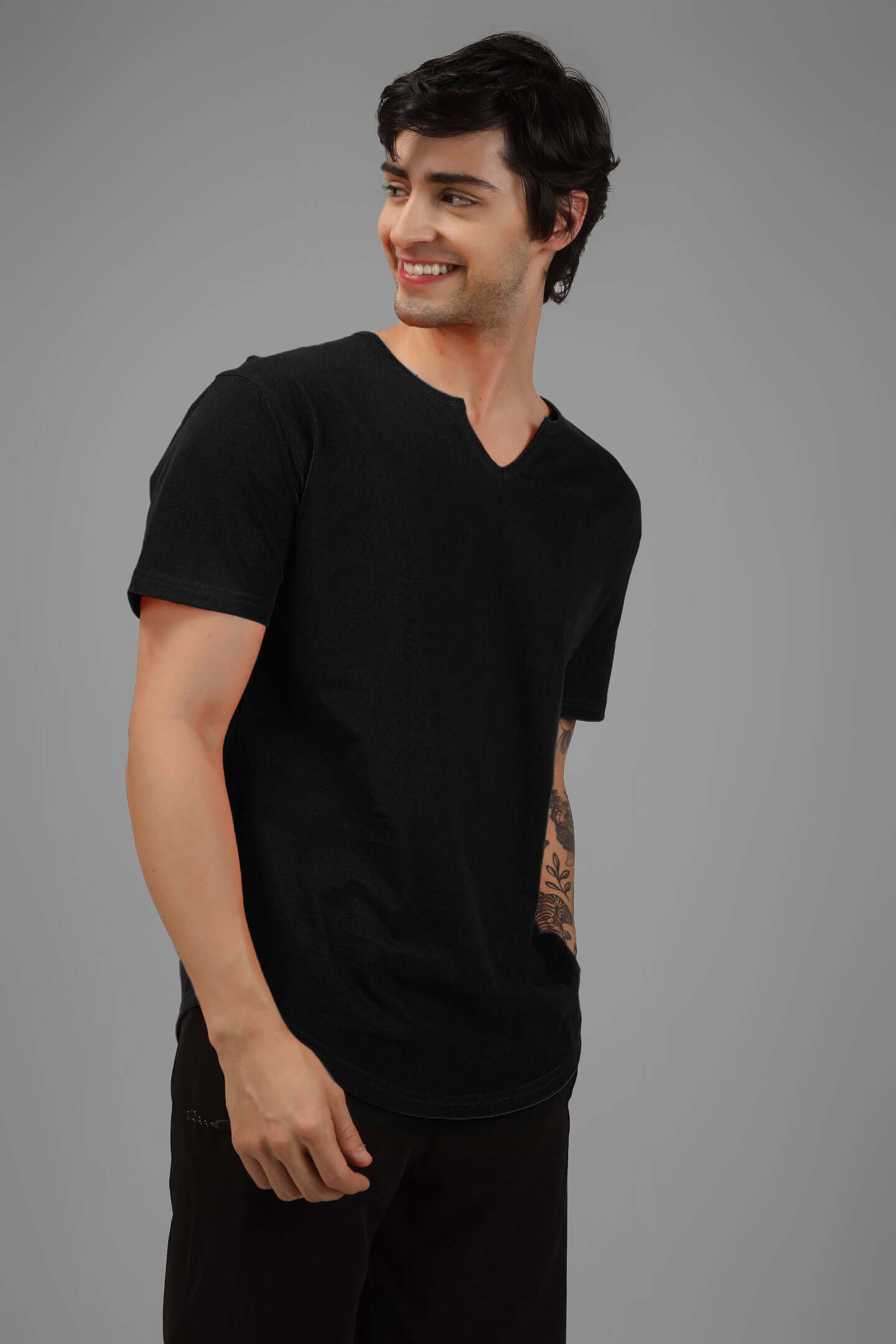 Man wearing VIKING REGULAR FIT T-SHIRT BLACK for a stylish look, made from breathable cotton fabric.