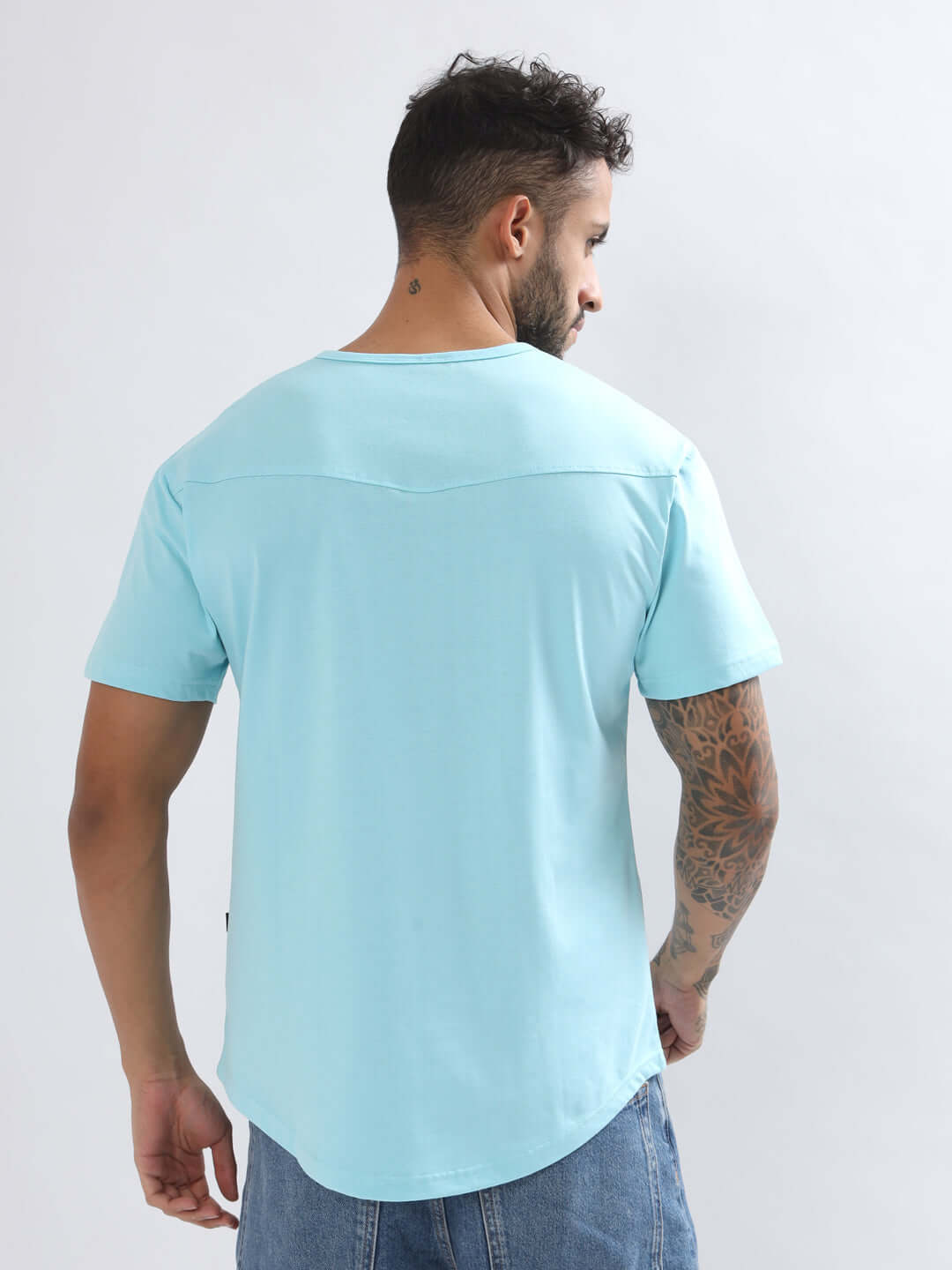 Back view of a man wearing a Viking Regular Fit Sky Blue T-shirt, highlighting its premium cotton material and stylish design.