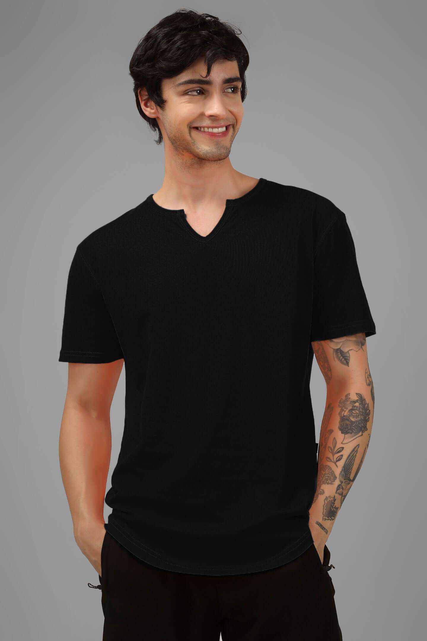 Man wearing VIKING REGULAR FIT T-SHIRT BLACK with tattoos, showcasing premium cotton fabric and bold style.