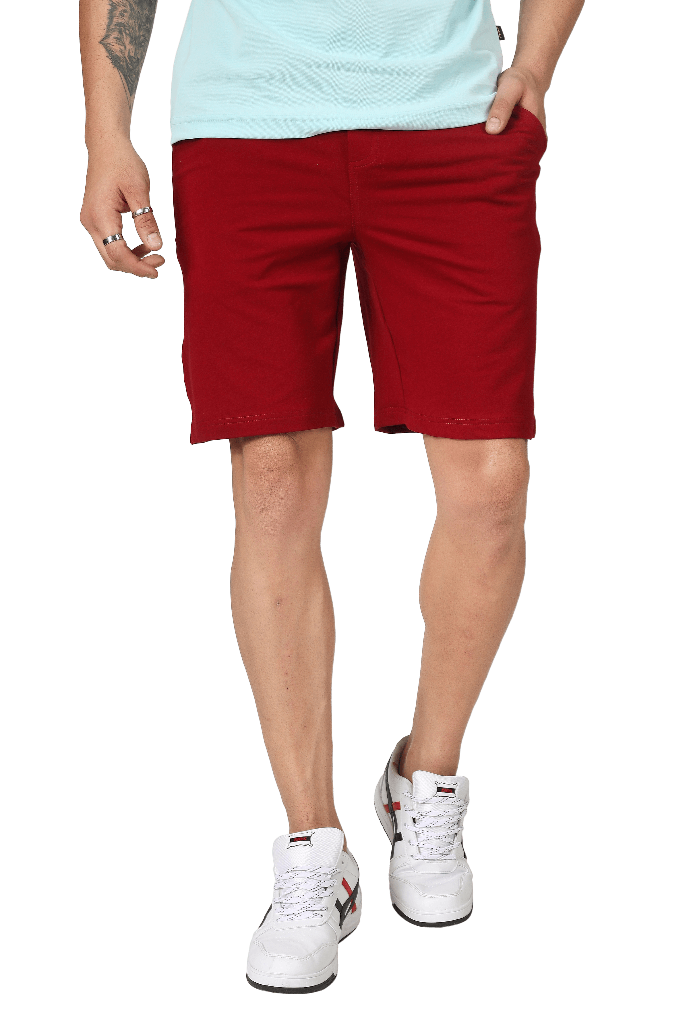 Man wearing vintage burgundy regular fit shorts with white sneakers