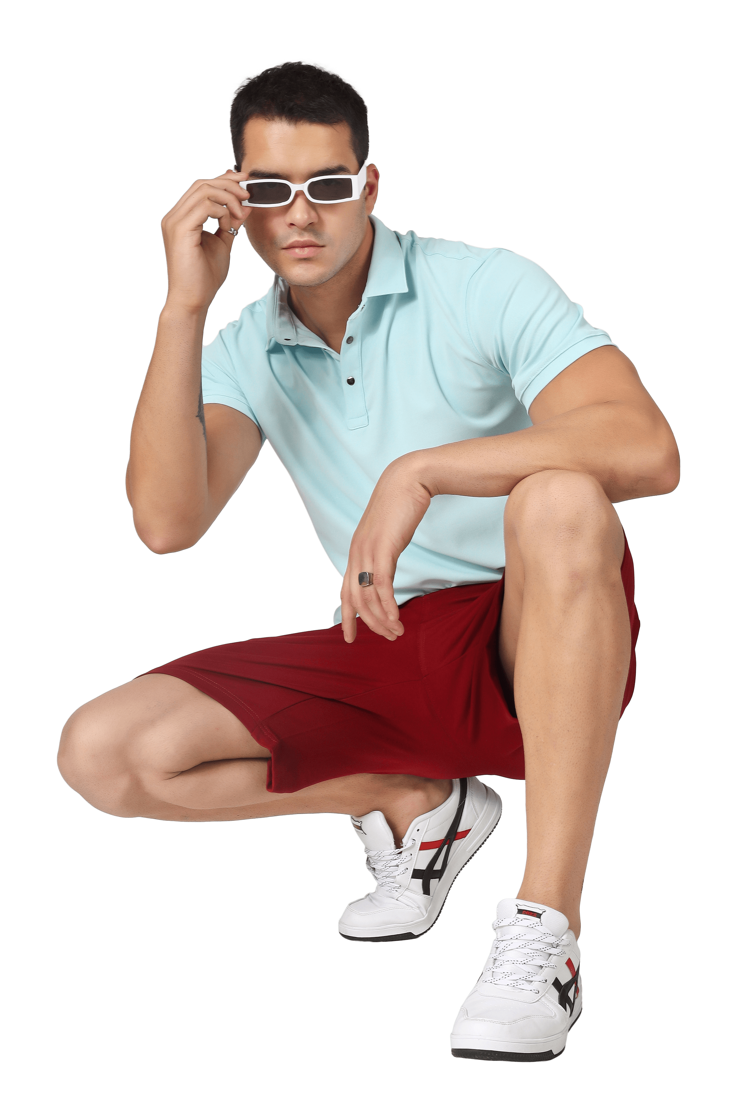 Model wearing vintage burgundy regular fit shorts, paired with a light blue polo shirt and white sneakers.