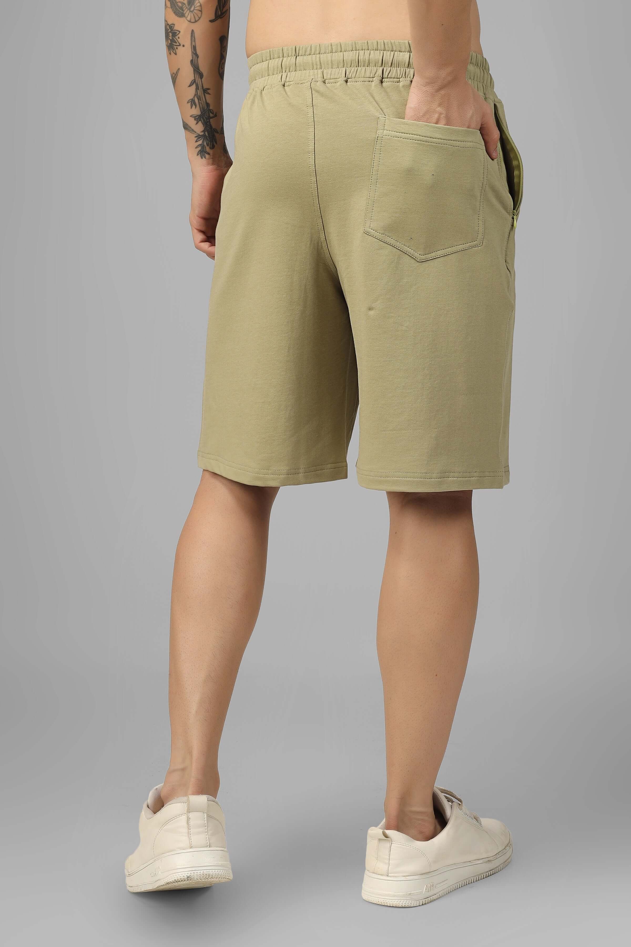 Rear view of men's vintage regular fit shorts in gravel green, showcasing pockets and elastic waistband.