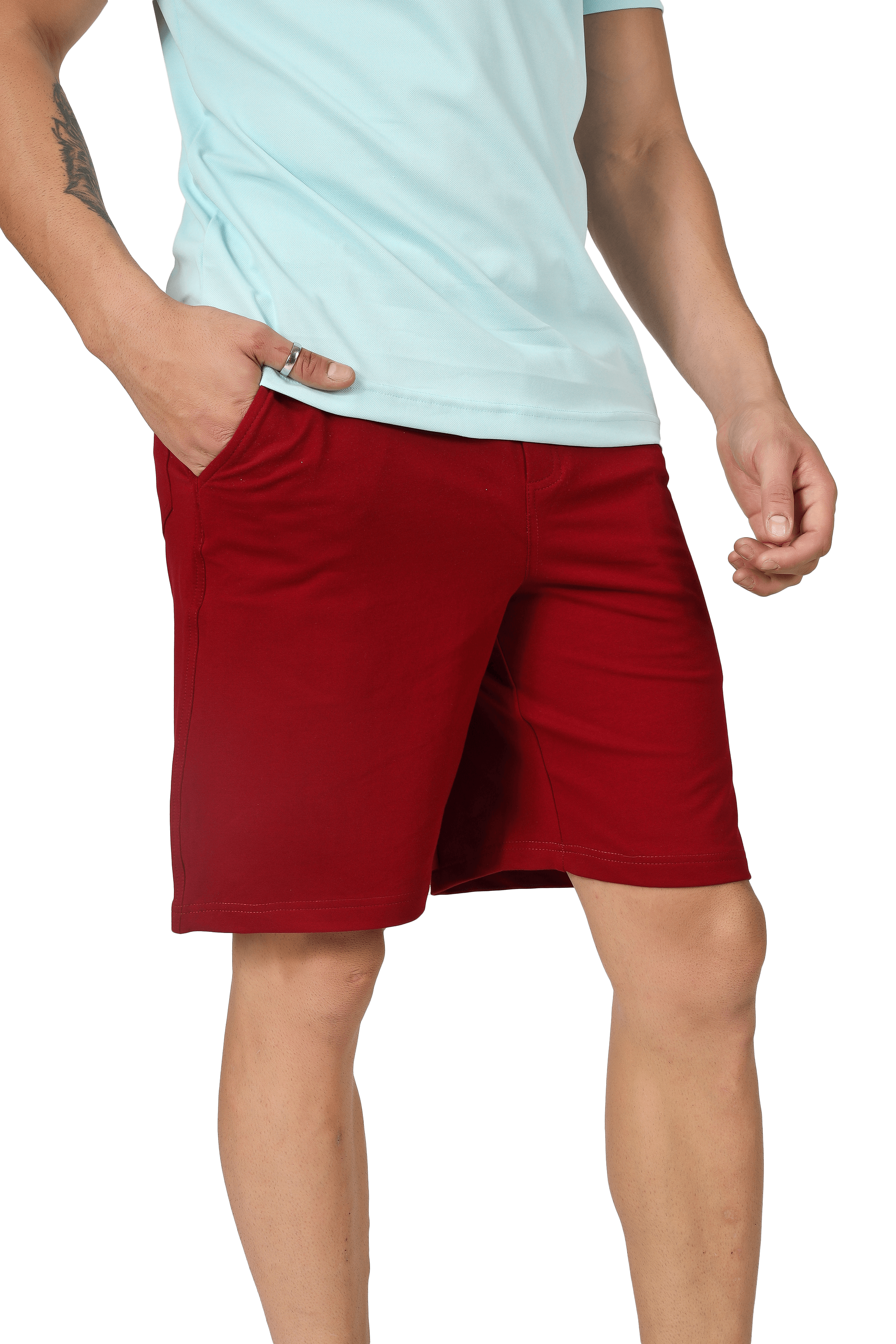 Person wearing vintage regular fit burgundy shorts with hand in pocket, showcasing casual summer style.