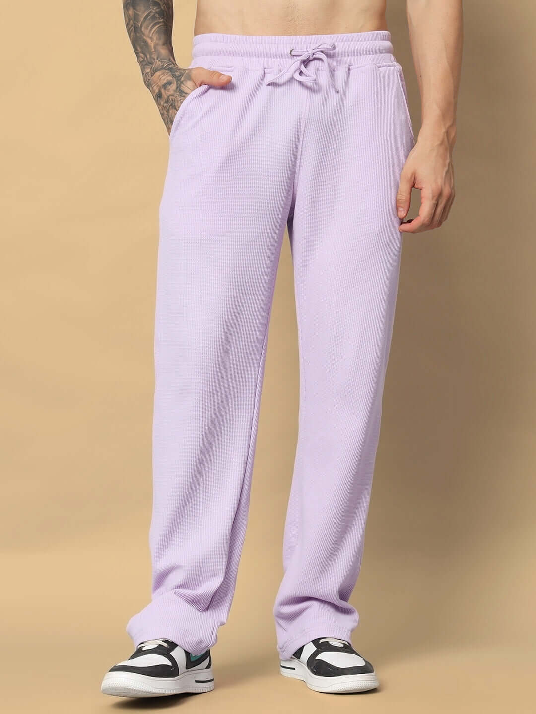VOGUE oversized lilac joggers with elastic waistband, unisex relaxed fit, premium waffle fabric, shown on person wearing sneakers.