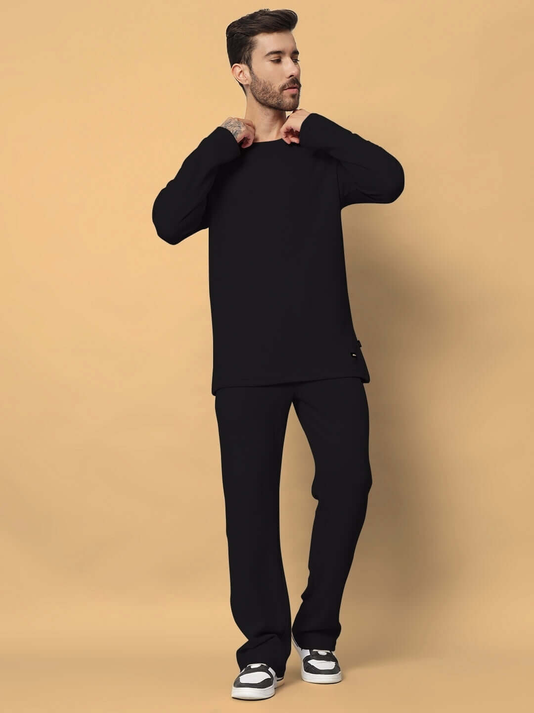 Unisex Vogue Oversized Co-Ord Set in black with relaxed joggers, elasticated waistband, 100% cotton waffle fabric, model standing.