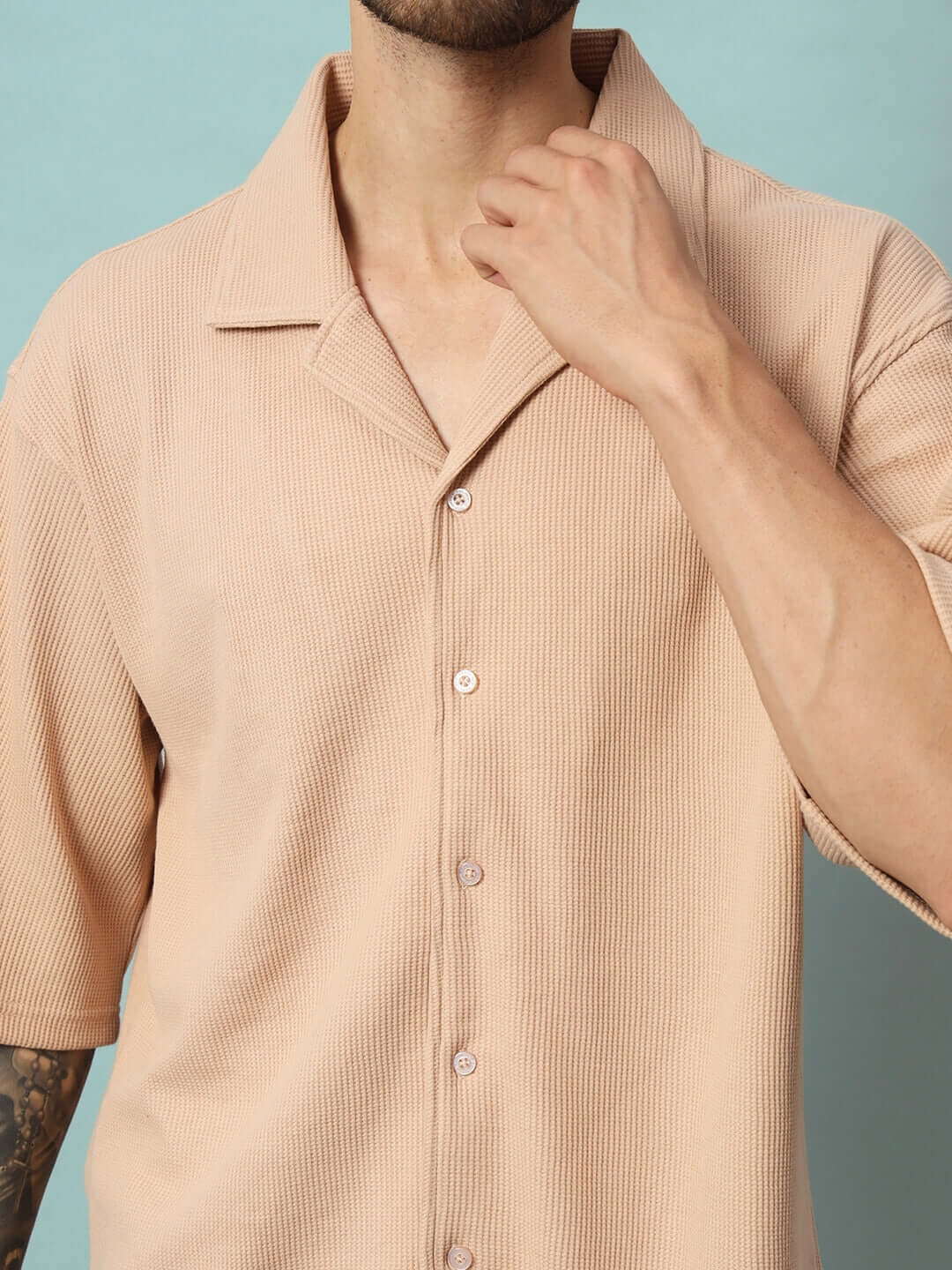 Model wearing beige waffle solid resort shirt co-ord set in 100% cotton fabric, half sleeves, relaxed fit, cold wash care.