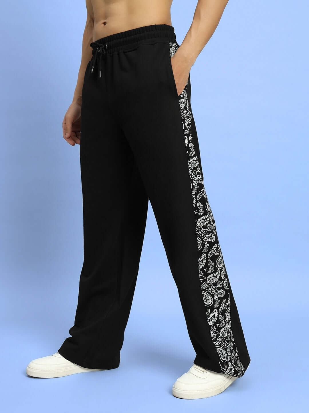 Model wearing Waltz Relaxed Fit Joggers in black, featuring side band design. Available in custom fit for prepaid orders from DUDS.