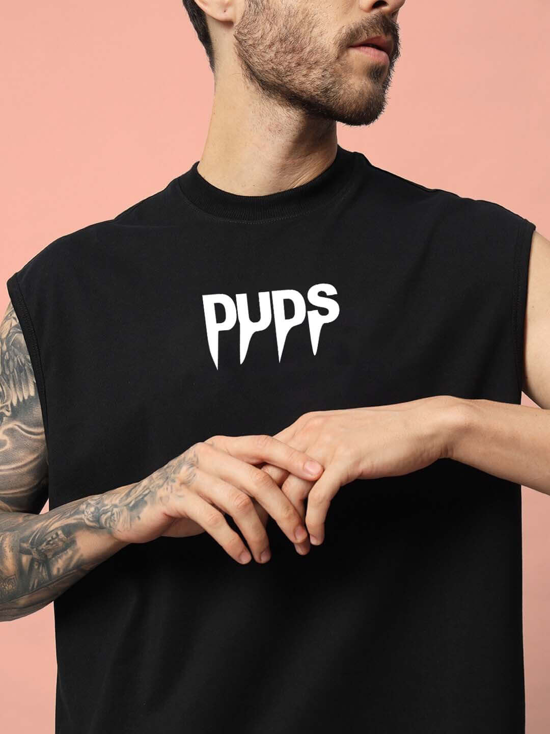 Man wearing black WANTED Gym T-shirt with DUDS logo, available in Custom Fit option for prepaid orders, showcasing athletic style.