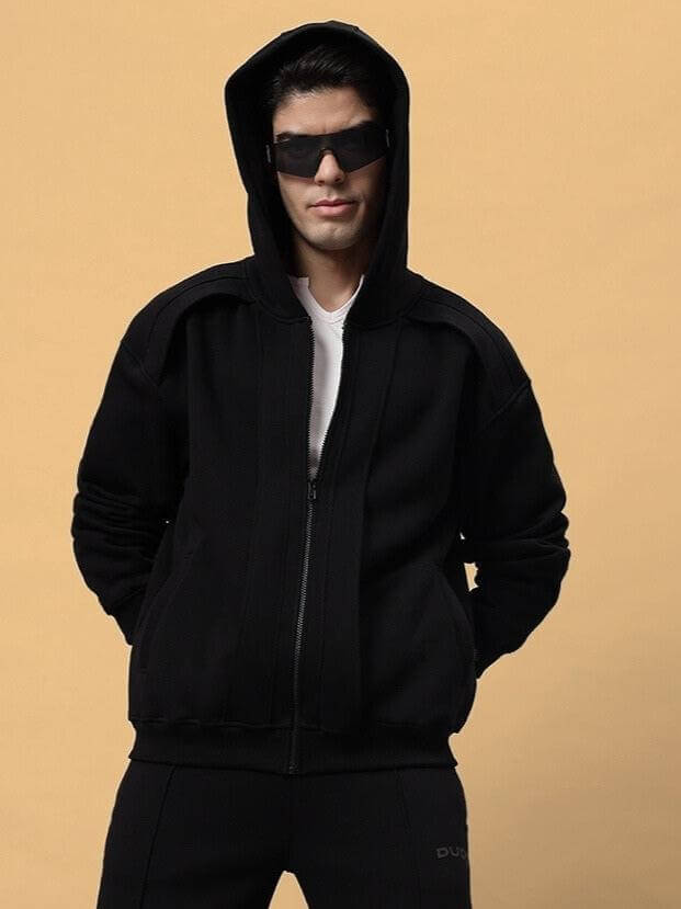 Model wearing WD ADMIRE COTTON FLEECE HOODIE BLACK, showcasing its oversized fit and cozy hood against a neutral background.