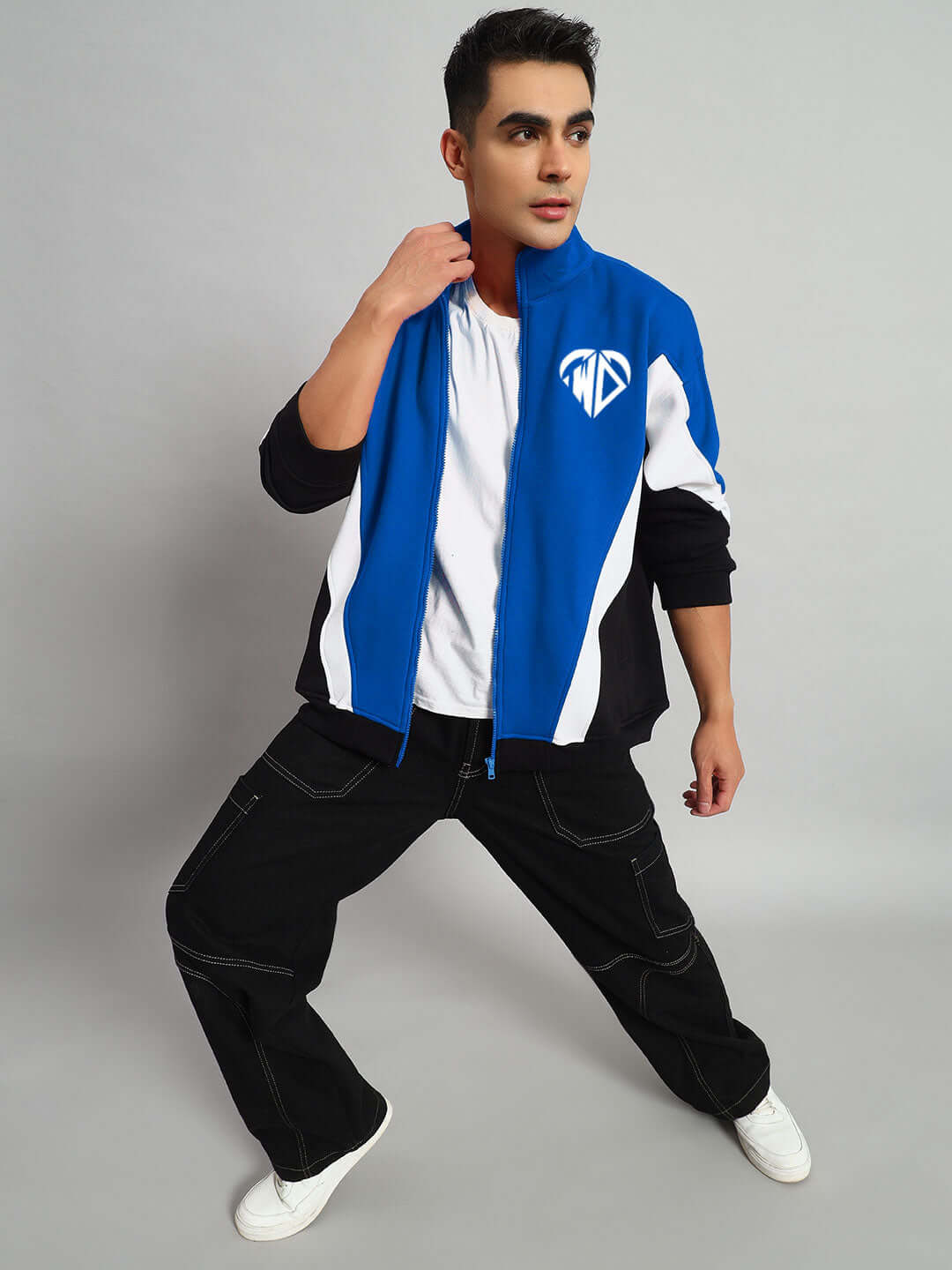 Person modeling WD Alfa Fleece Colorblock Jacket in blue with sporty design and full-zip, perfect for casual wear.