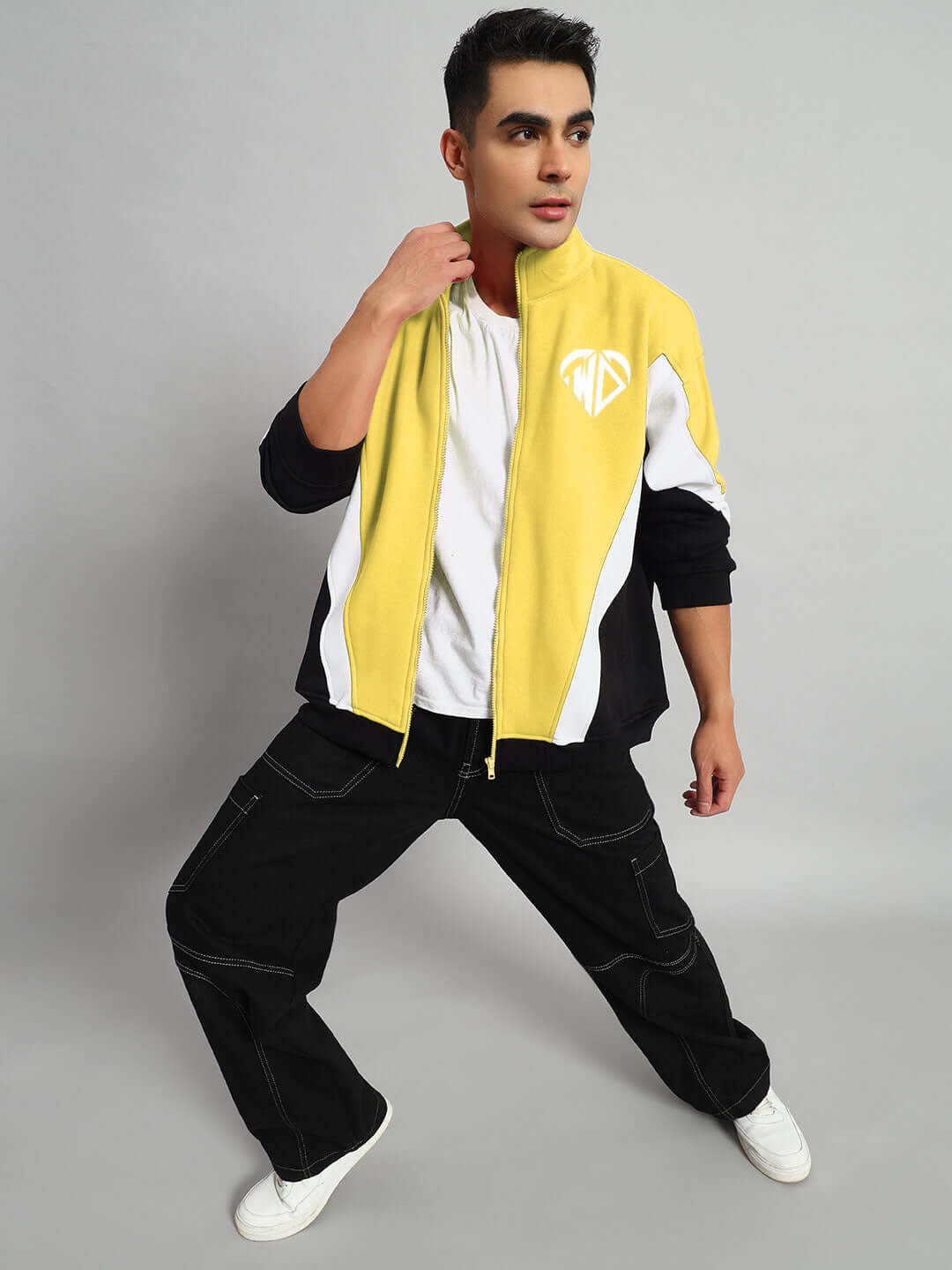 Model wearing WD Alfa Fleece Colorblock Jacket in yellow, showcasing a stylish design with contrasting black and white panels.