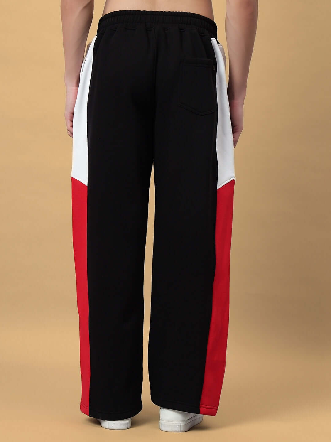 Back view of WD FERVID FLEECE COLORBLOCK CARGO PANT BLACK with red and white colorblock design.