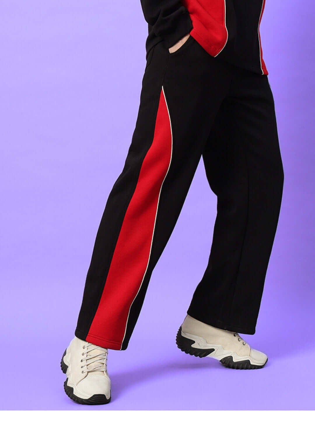 WD FIREBALL colorblock cargo pant in black and red worn with white sneakers on purple background