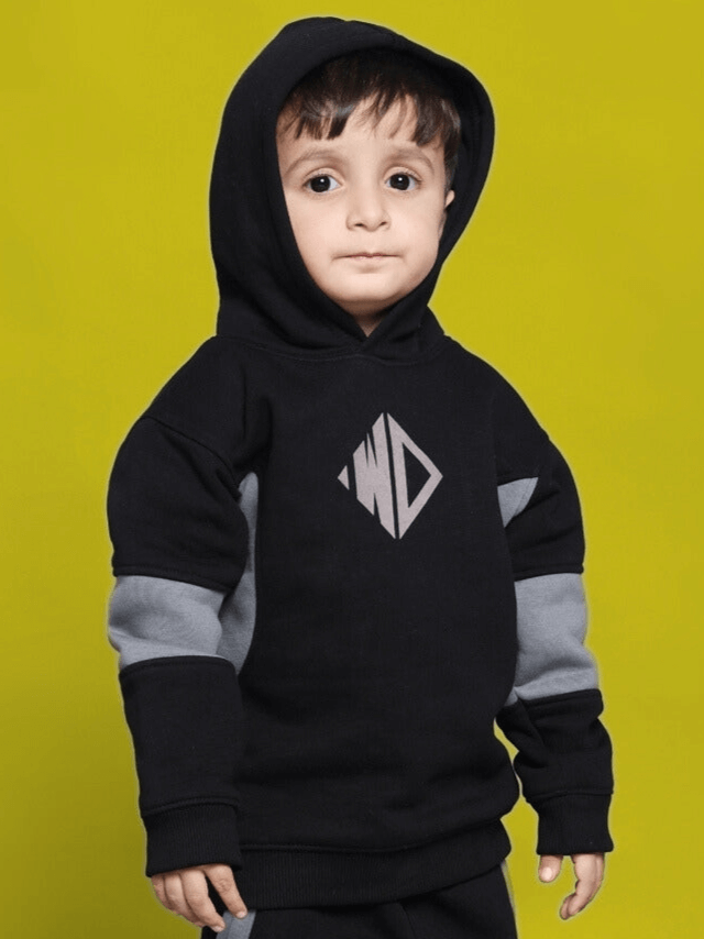 Child wearing WD Gorbcore Fleece Hoodie for Boys Girls Black Grey with colorblock design, showcased on a yellow background.