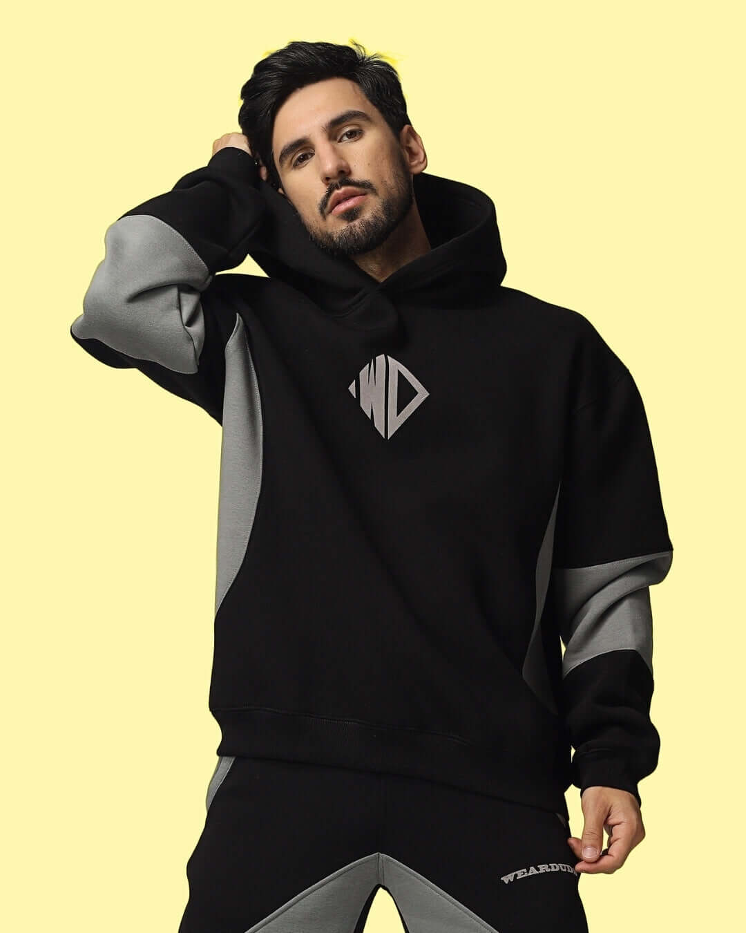 WD GORBCORE colorblock hoodie in black-grey on model, featuring modern style and comfortable fit, perfect for casual wear.