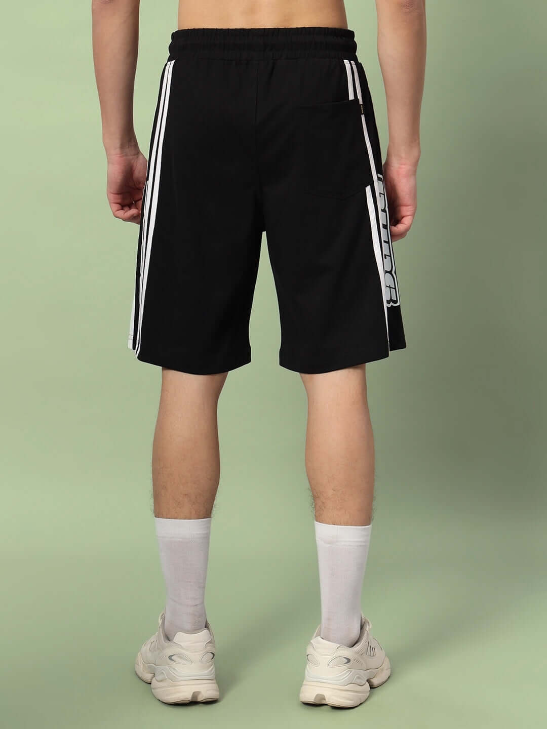 Back view of WD Premium Regular Fit Black Shorts with white stripes, worn by a model, ideal for customizable size options.