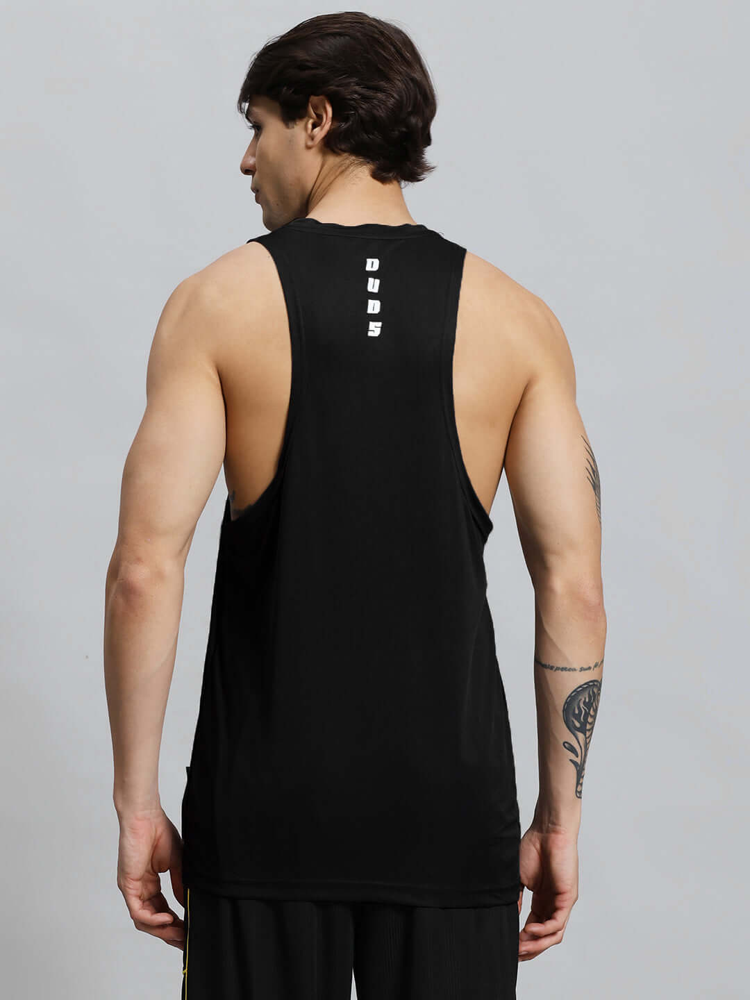 Man wearing WD STRINGER GYM SLEEVELESS T-SHIRT BLACK from the back