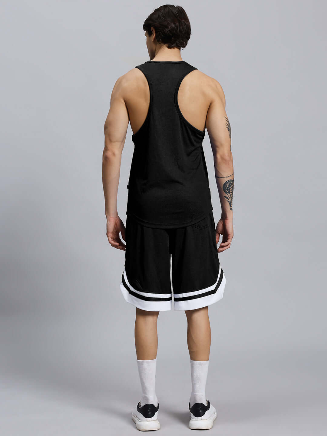 Back view of WD WINGS GYM CO-ORD SET MEN BLACK showcasing athletic fit and wing detailing for style and flexibility during workouts.