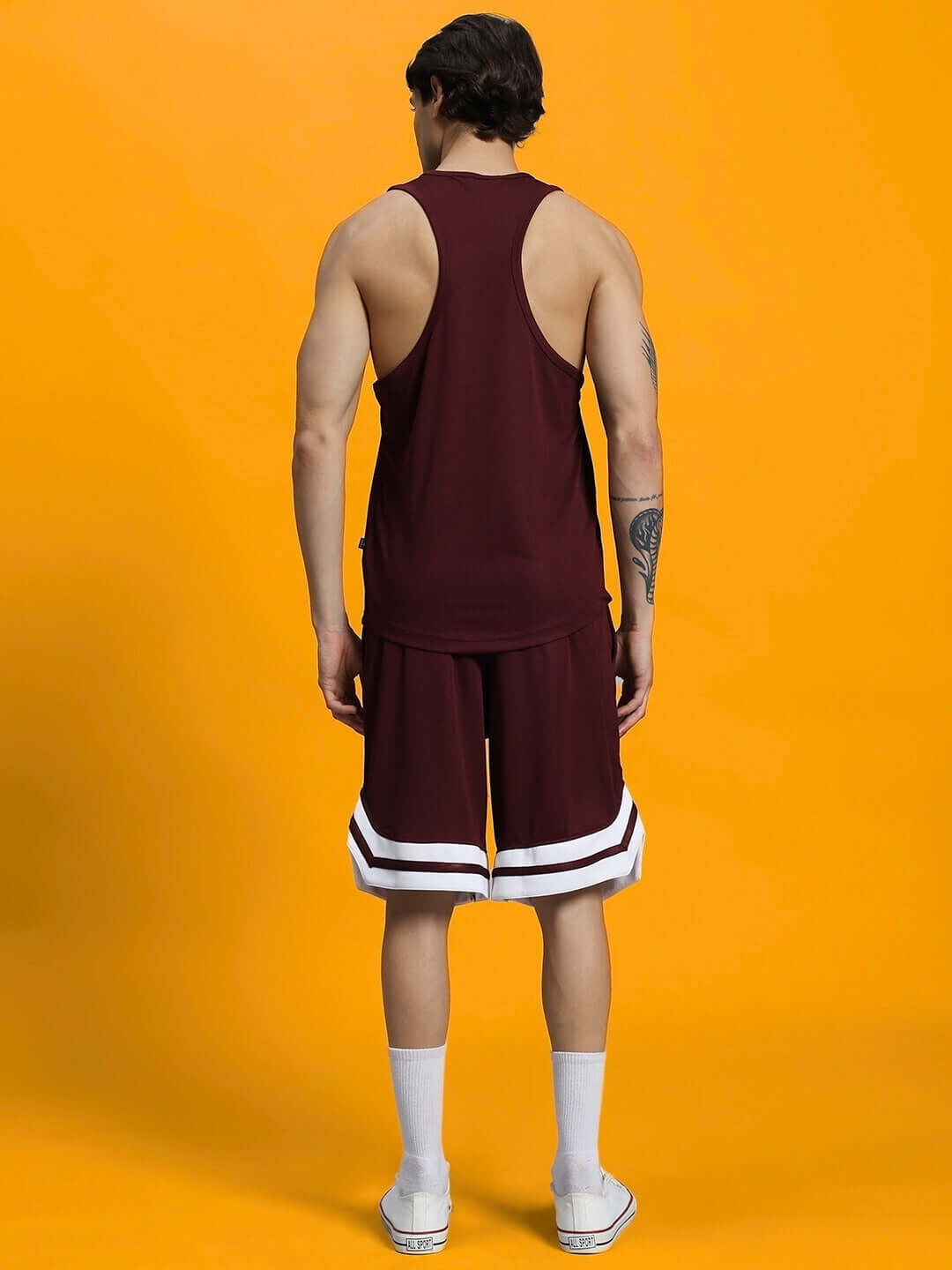 Man wearing WD WINGS GYM CO-ORD SET MAROON from the back, stylish maroon activewear for workouts.