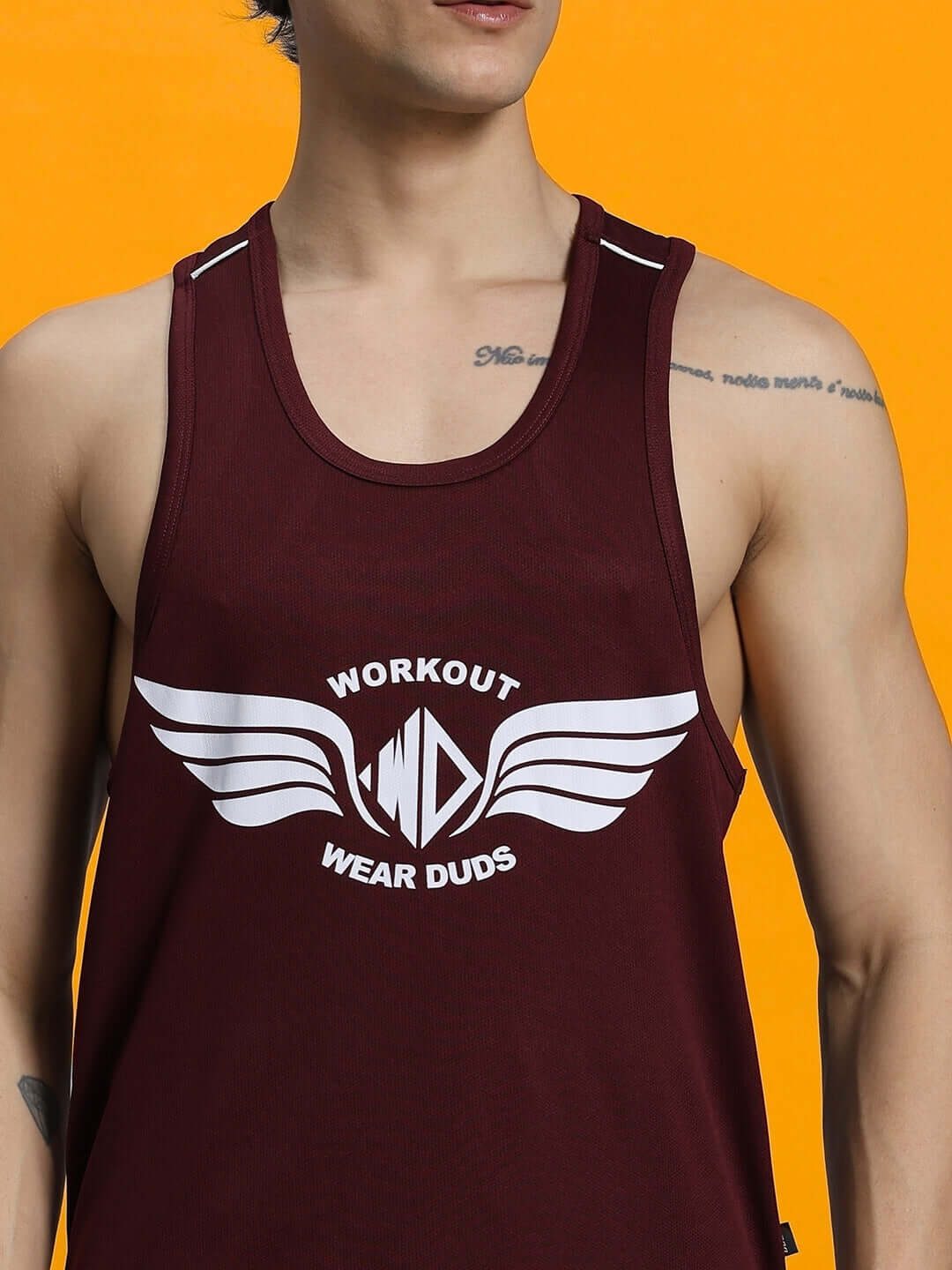 Man wearing WD WINGS GYM CO-ORD SET MAROON tank top for workouts