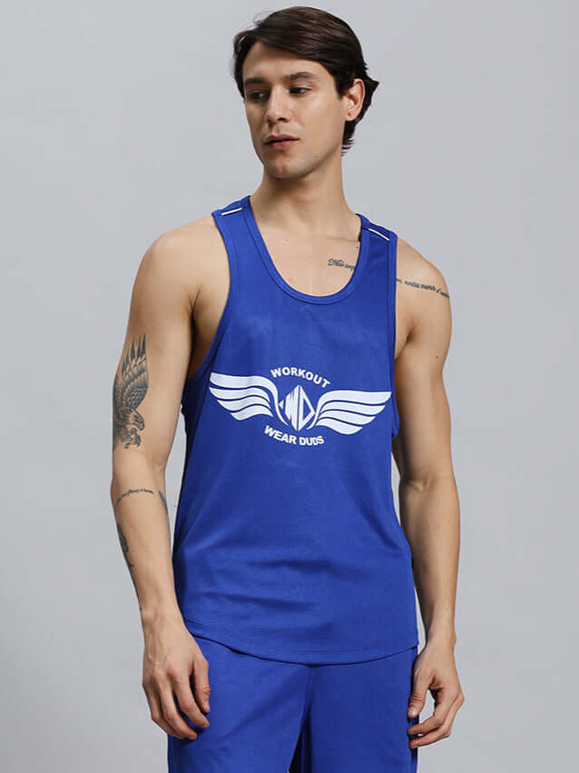 Man wearing WD WINGS GYM T-SHIRT ROYAL BLUE with wing logo, perfect for workouts, made from breathable, lightweight polyester for men.