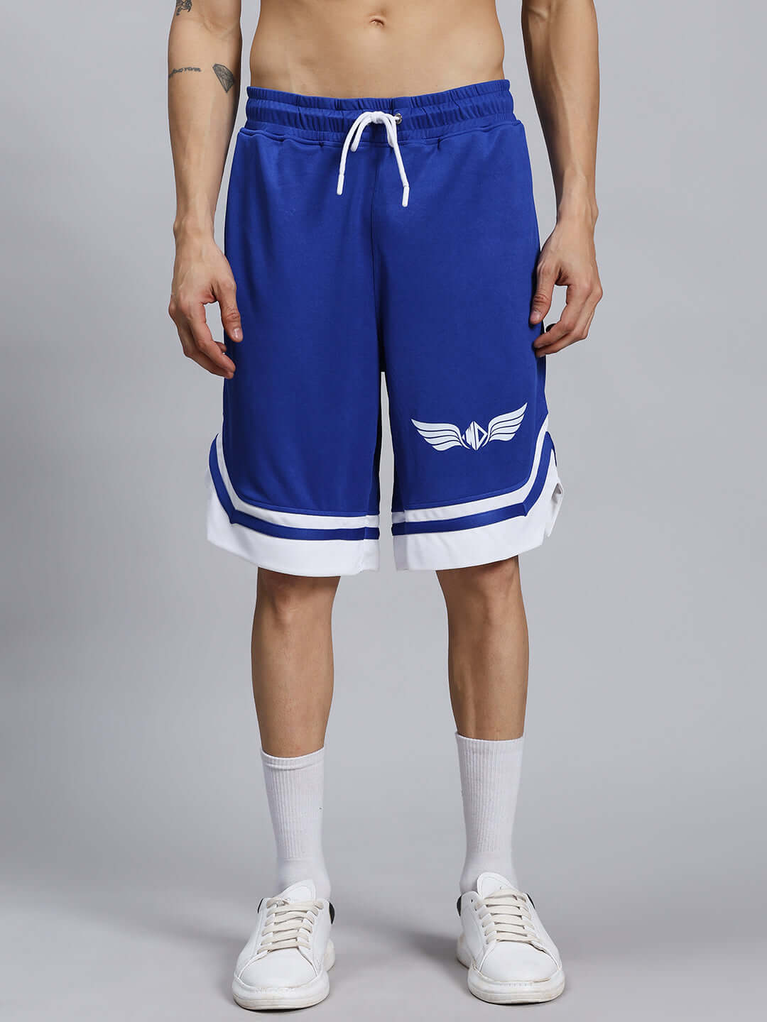 Front view of man wearing WD WINGS REGULAR FIT SHORTS ROYAL BLUE, showcasing sporty design and comfortable fit.