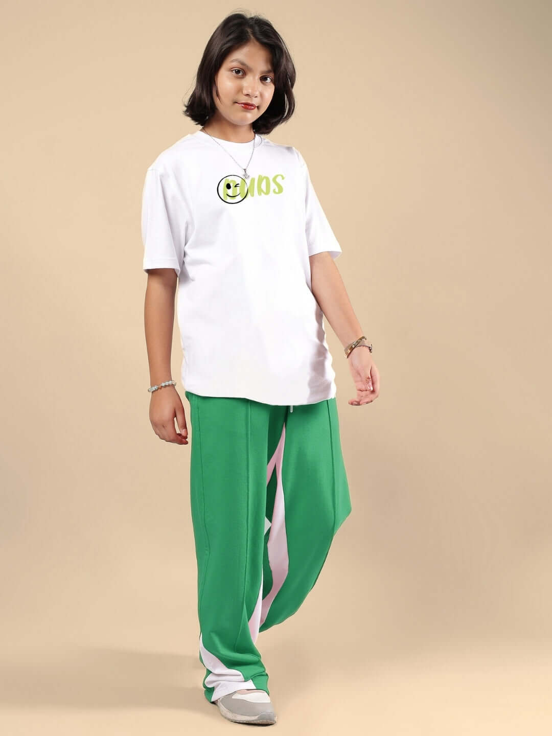 Child wearing JUST WANNA BE CO-ORD FOR BOYS & GIRLS WHITE-GREEN, showcasing trendy and comfortable kids fashion.