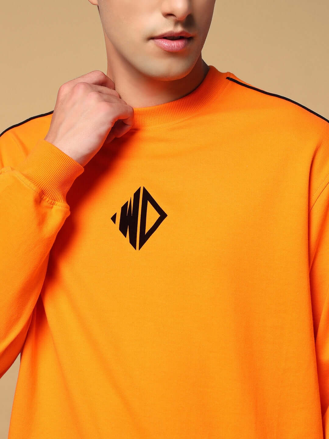 WHOPPER oversized orange sweatshirt made of premium cotton French terry with black emblem, comfortable and stylish casual wear.