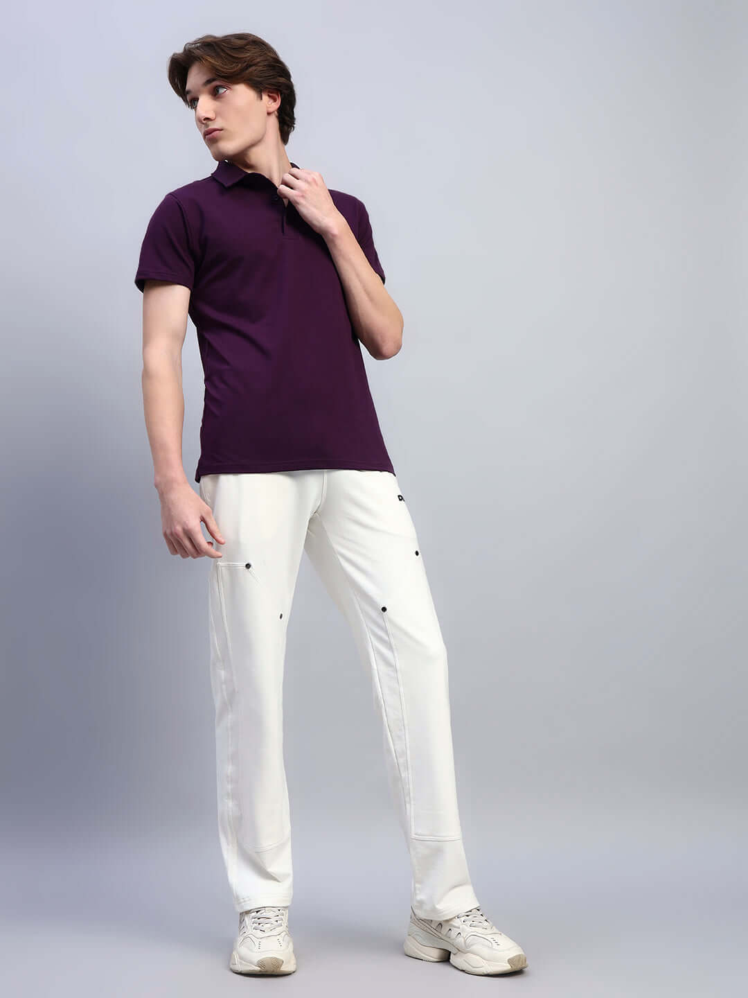 Model wearing WIDEL REGULAR FIT T-SHIRT PURPLE with white pants, showcasing a stylish and comfortable casual look.