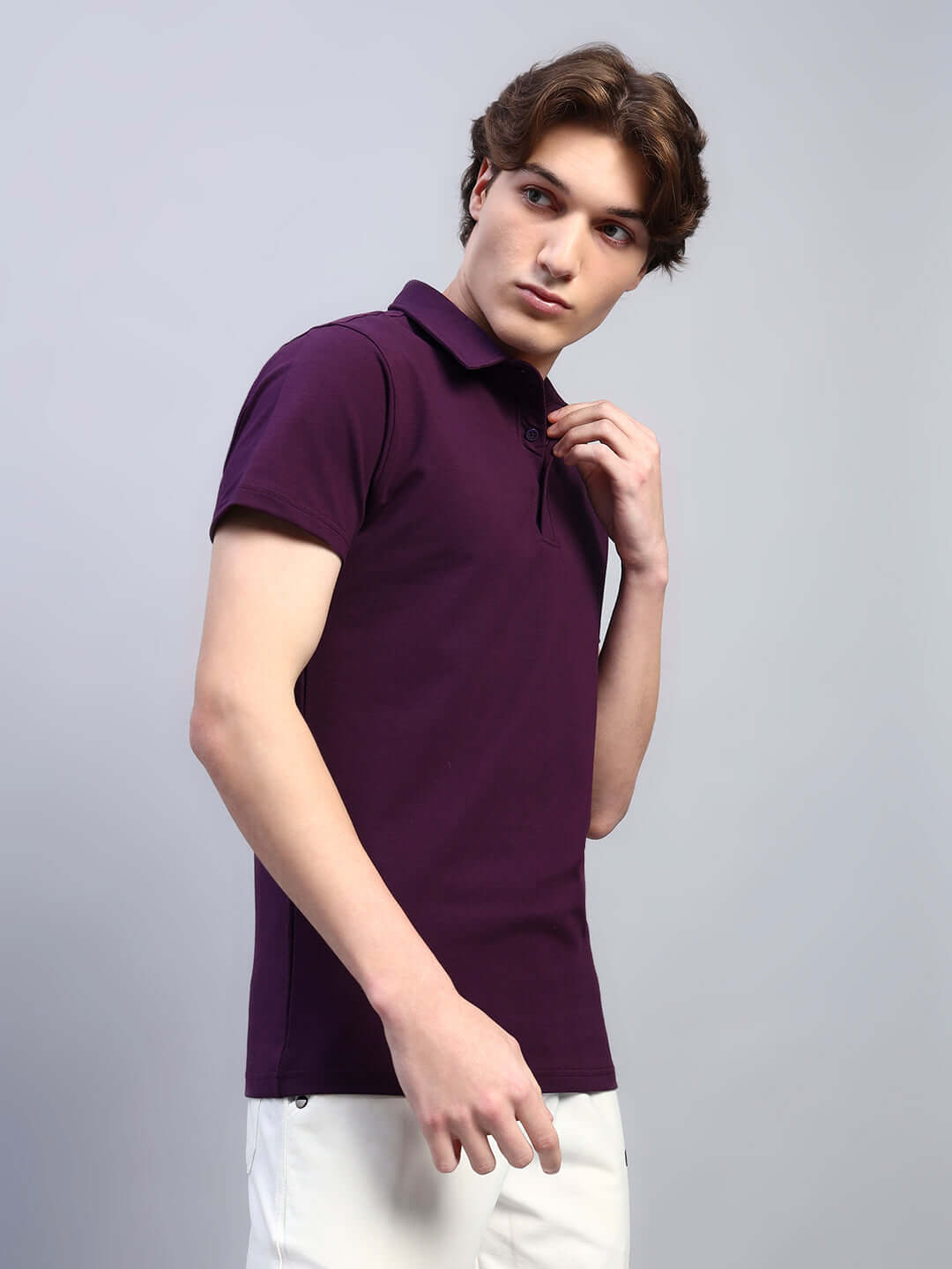 Man wearing WIDEL REGULAR FIT T-SHIRT PURPLE against a gray background