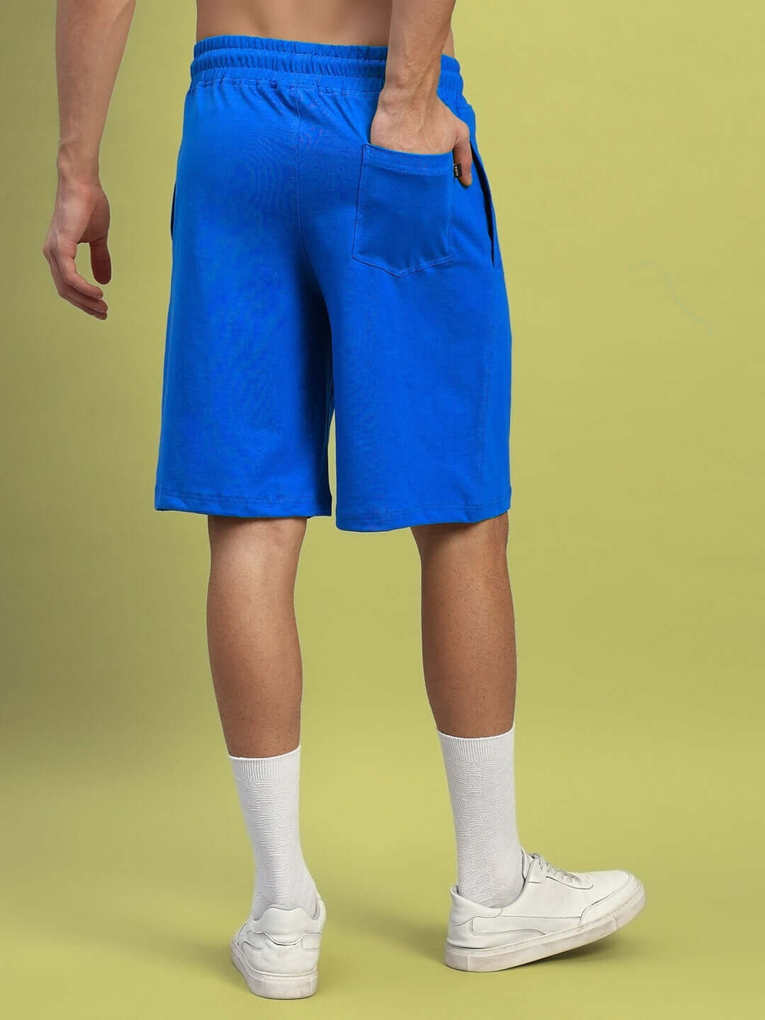 Back view of royal blue Wideline Regular Fit Shorts featuring a pocket, suitable for casual wear with a customizable size option.