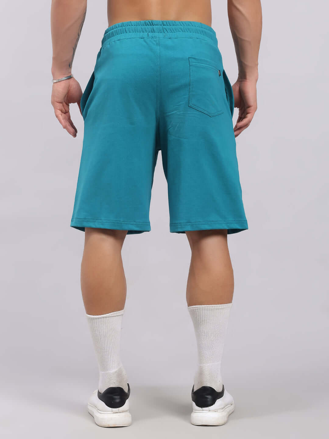 Back view of WIDELINE SUMMER CO-ORD SET TEAL shorts showing elastic waistband.