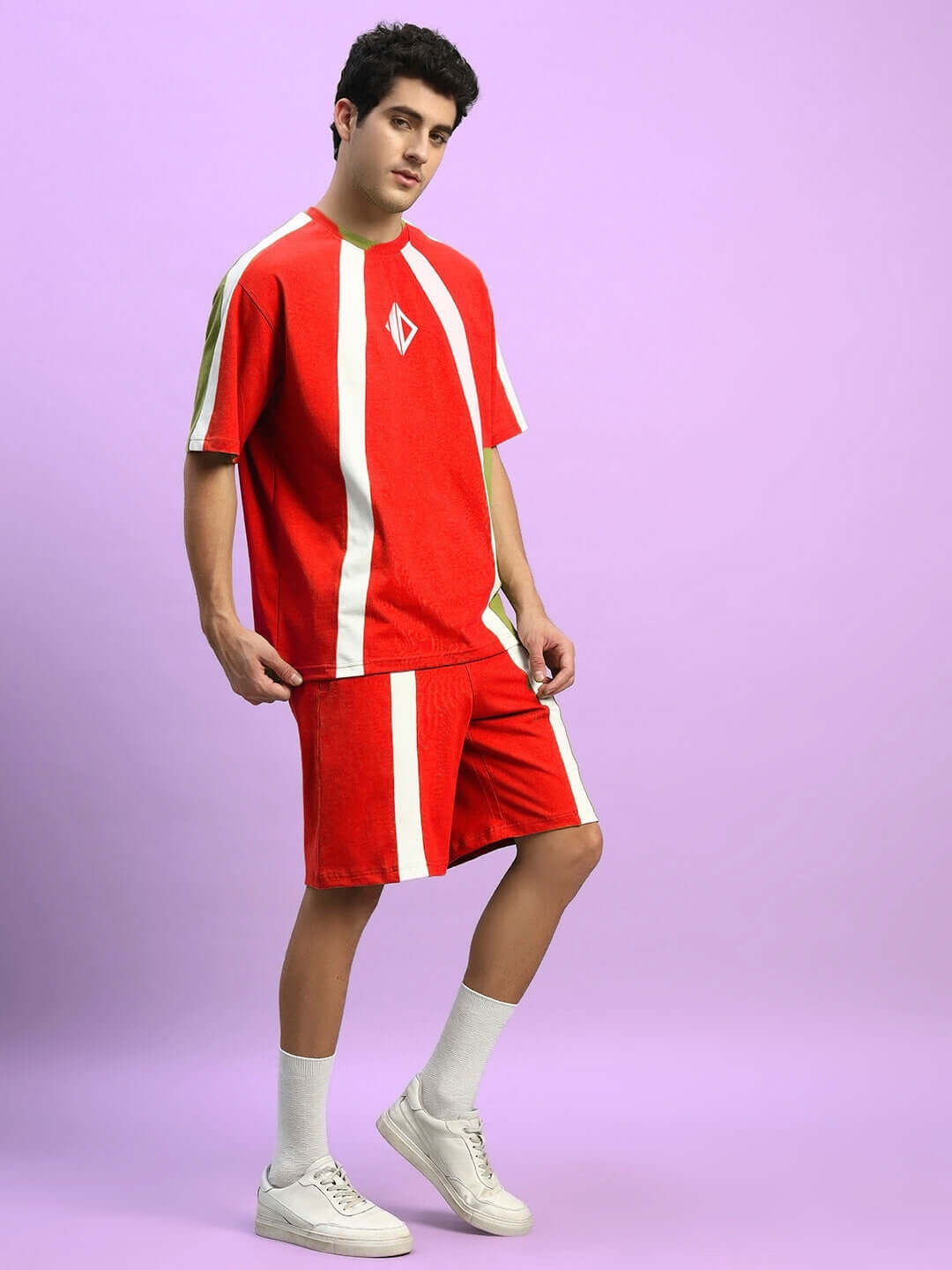 Model in WIDELINE SUMMER CO-ORD SET RED with matching red t-shirt and shorts, perfect for casual summer style.