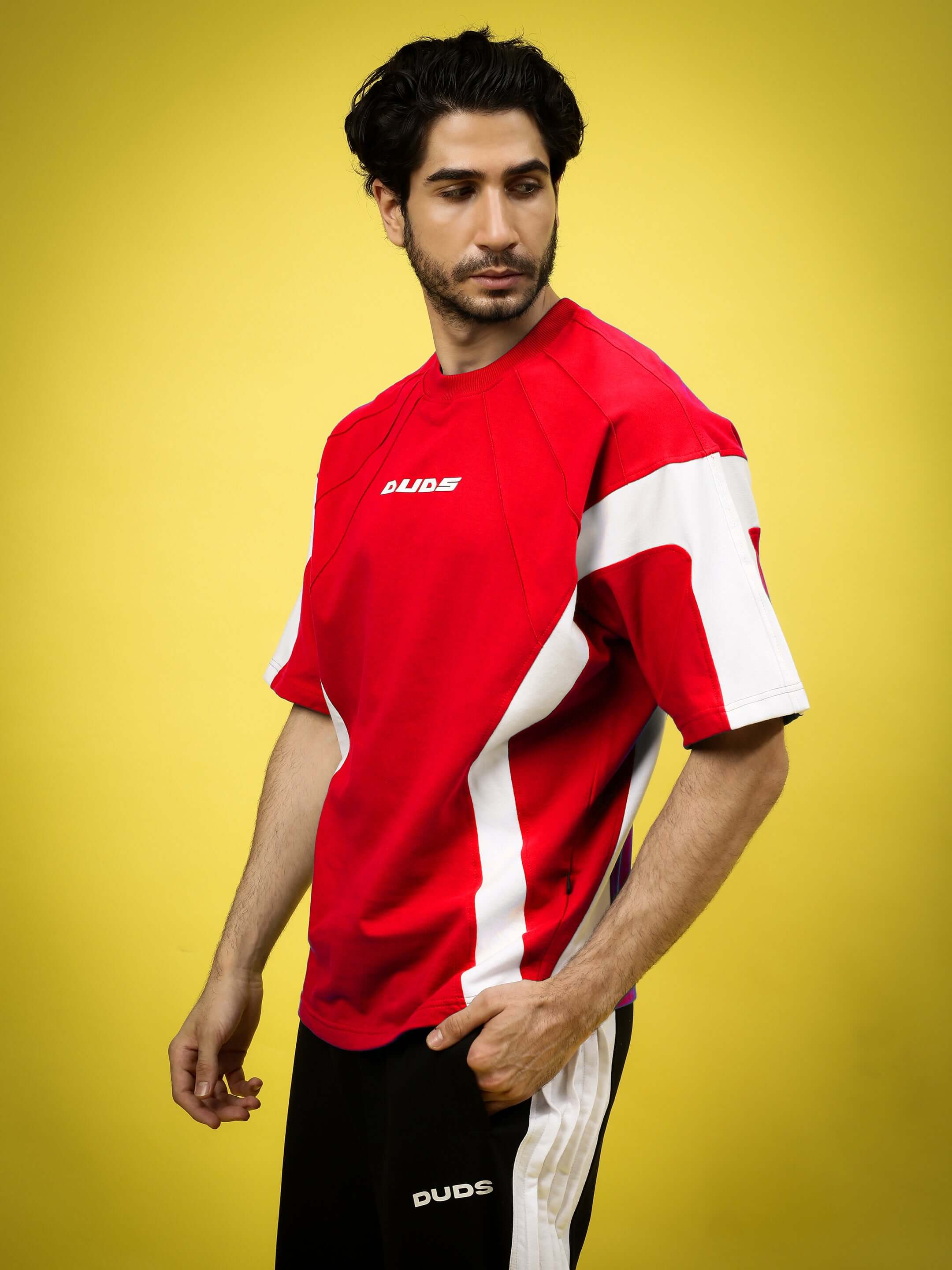Model wearing Wild Force oversized red-white T-shirt made of premium heavy gauge fabric. Ideal for comfortable fashion.