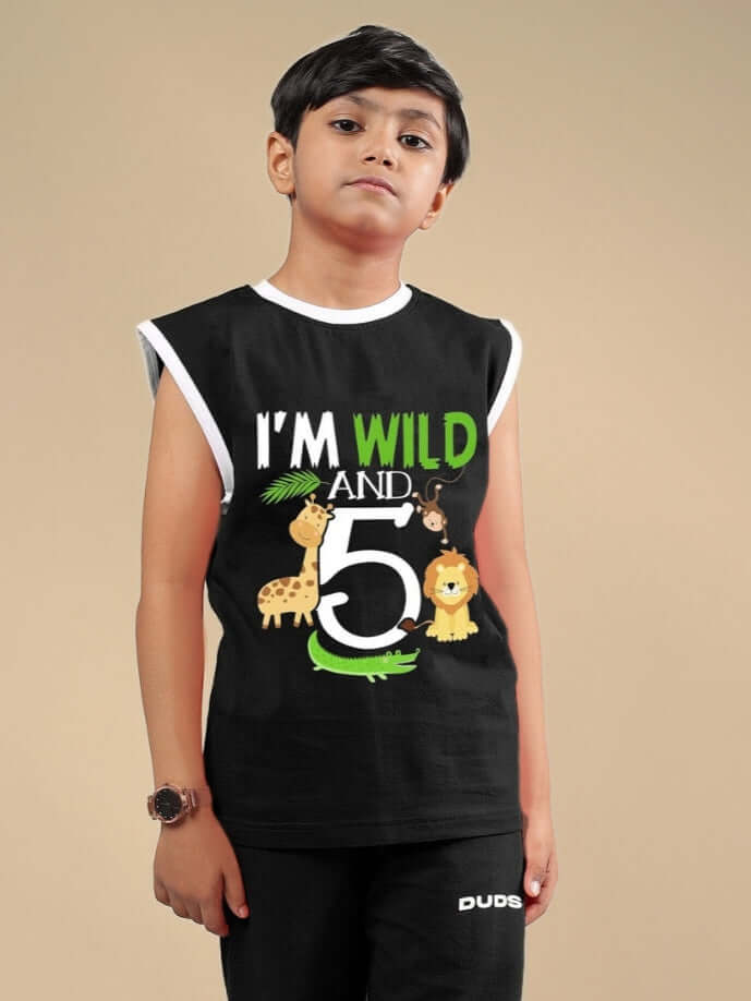 Child wearing black Wild Planet t-shirt with animal design, tailored for boys and girls. Customizable and made to order by DUDS.
