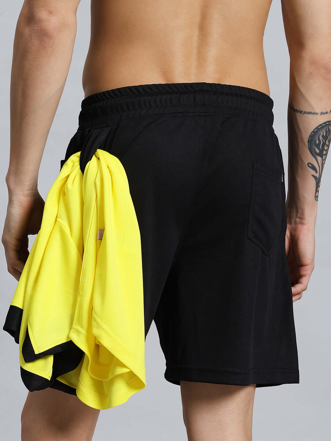 Back view of WILY TACTICAL REGULAR FIT SHORTS MEN BLACK worn by a male model, showing pocket design and fabric texture.