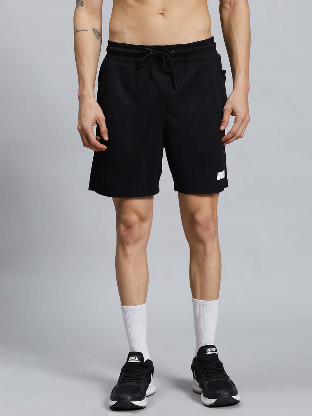 Person wearing WILY TACTICAL REGULAR FIT SHORTS MEN BLACK for comfort and performance