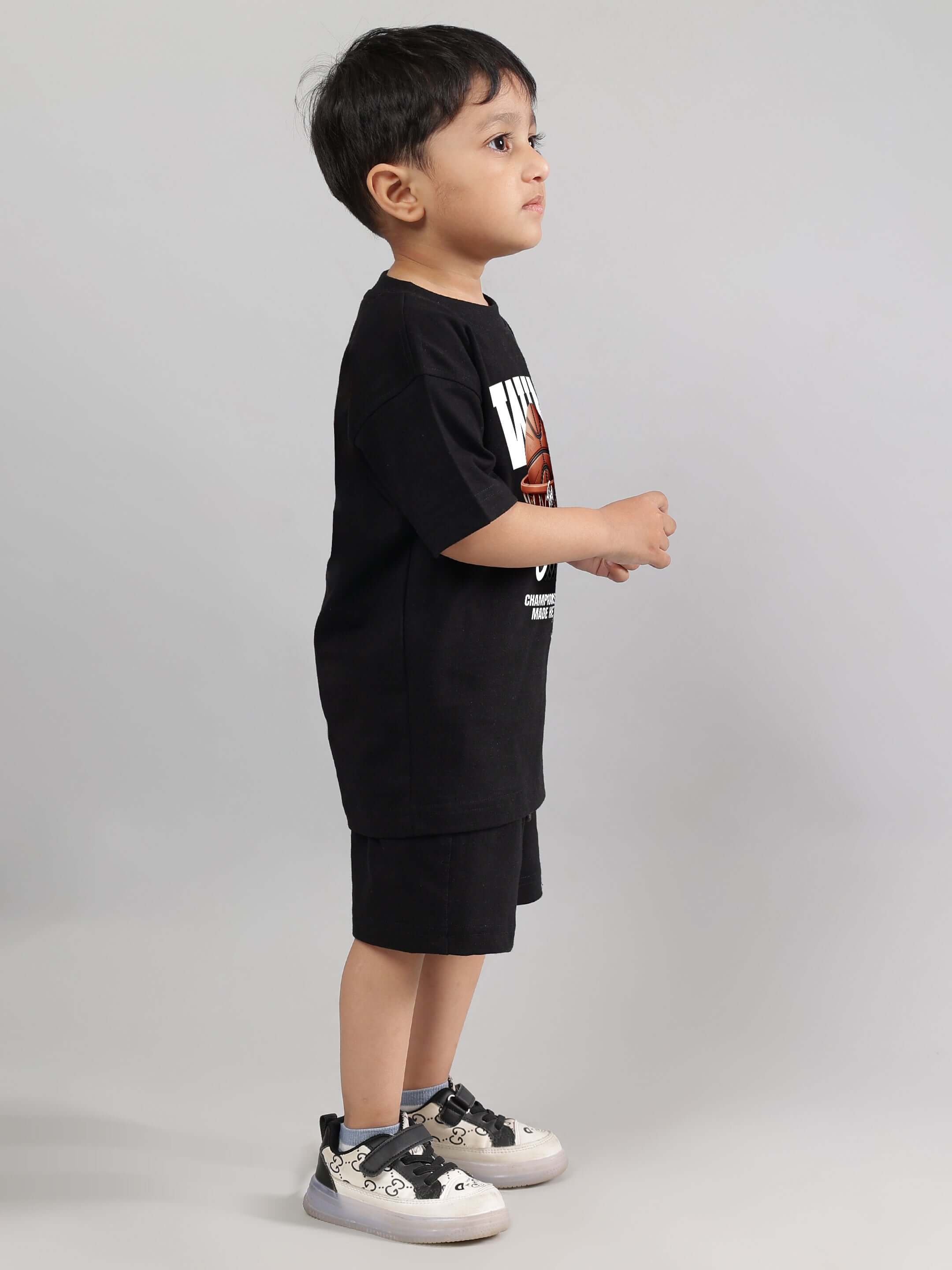 Child wearing WIN DAY CO-ORD FOR BOYS GIRLS BLACK, featuring a stylish black graphic t-shirt and shorts set.