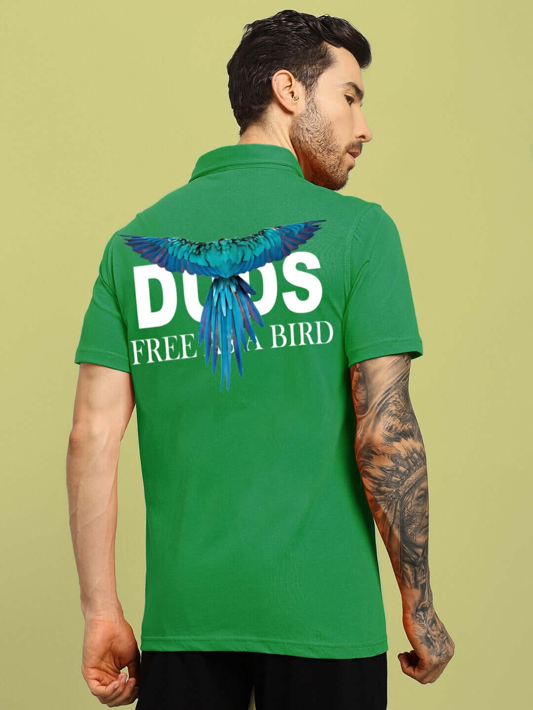 Model wearing green Wings Tee Regular Fit Shirt by DUDS with 'Free as a Bird' print on back