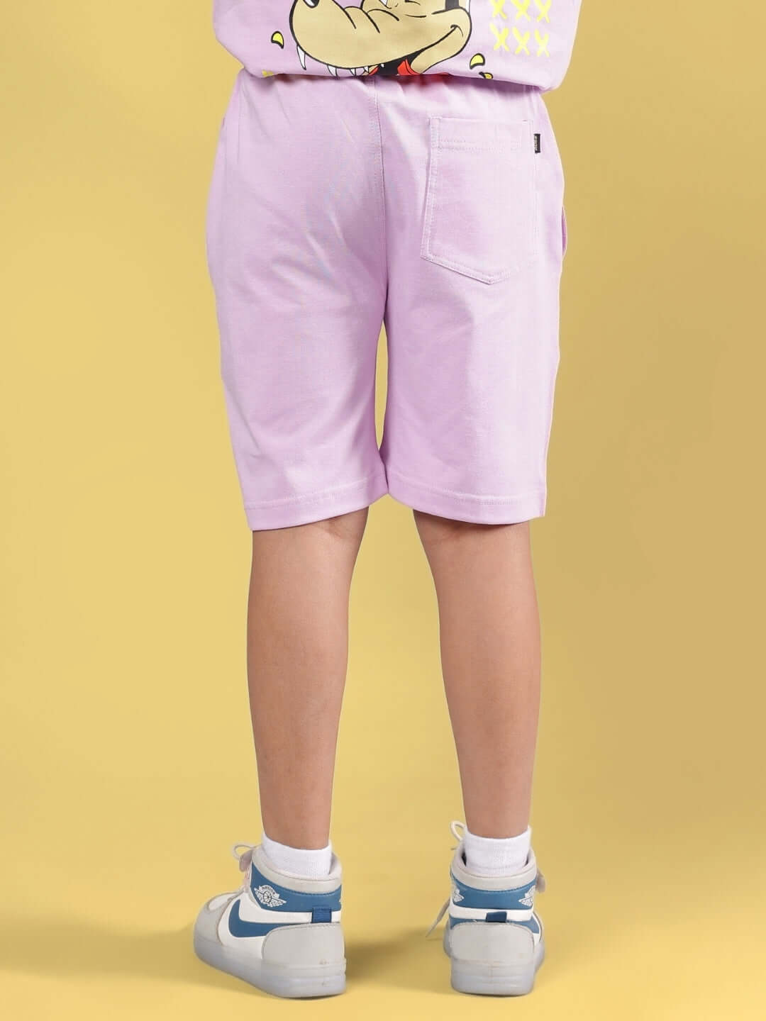 Rear view of WOLF PACK SHORTS FOR BOYS & GIRLS LILAC, showcasing comfortable fit and style in a light purple color.