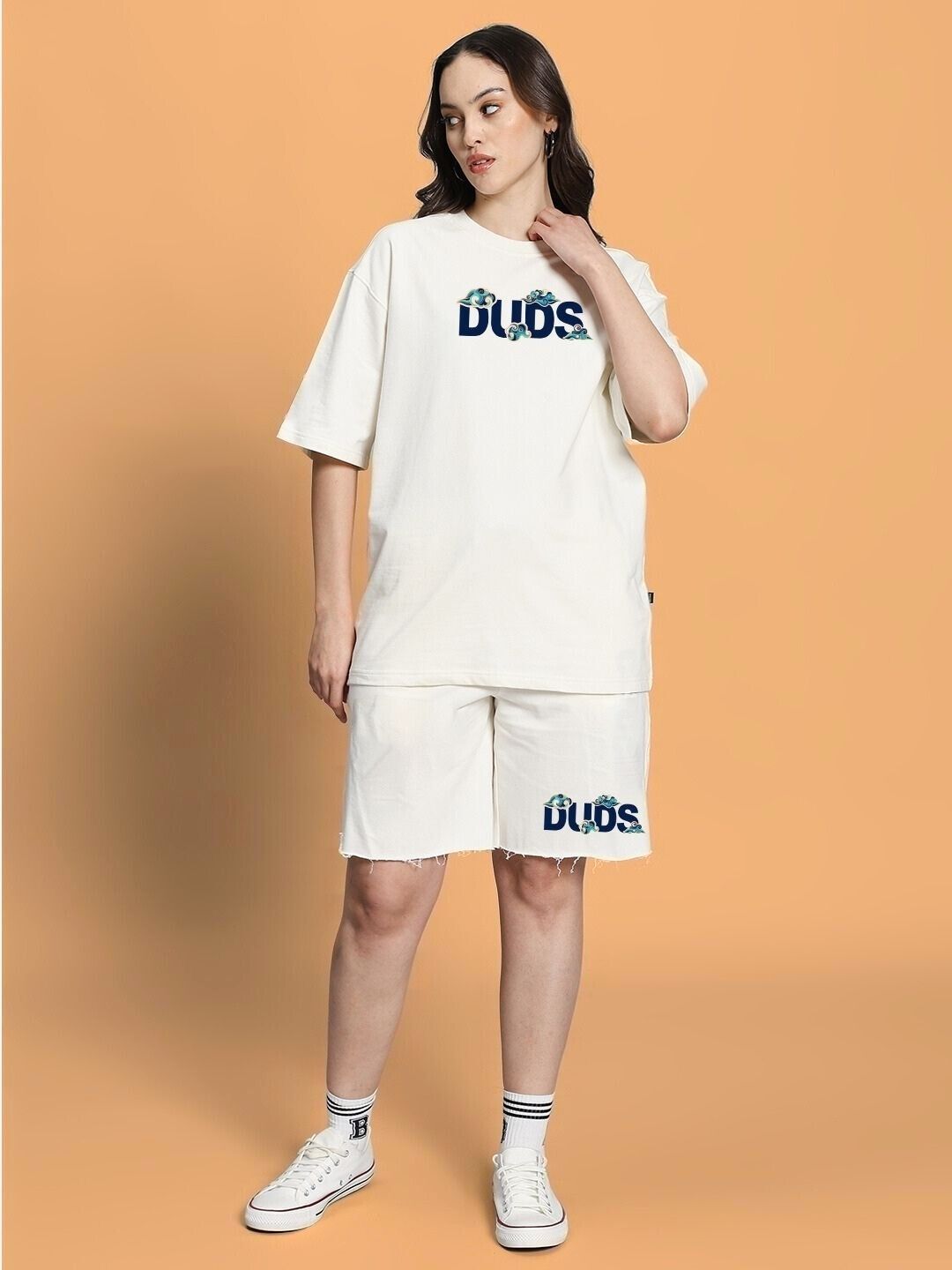 Model wearing WOMEN CLOUD PRINTED CO-ORD SET OFF WHITE with cloud prints on a stylish off-white background, showcasing relaxed-fit top and shorts.