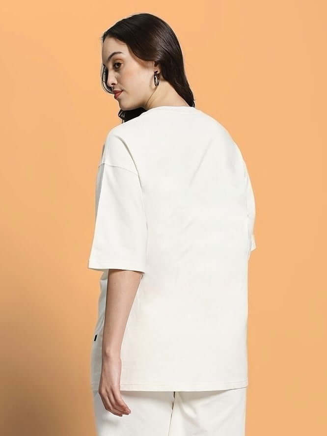 Model wearing WOMEN CLOUD PRINTED OVERSIZED T-SHIRT OFF WHITE, showcasing back view with relaxed fit and soft fabric.