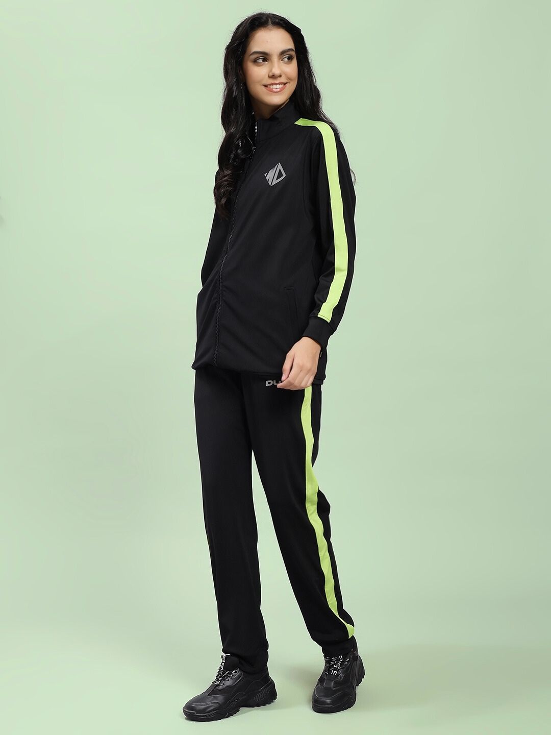 Woman wearing WOMEN HIGH PERFORMANCE CO-ORD SET BLACK with neon stripes.